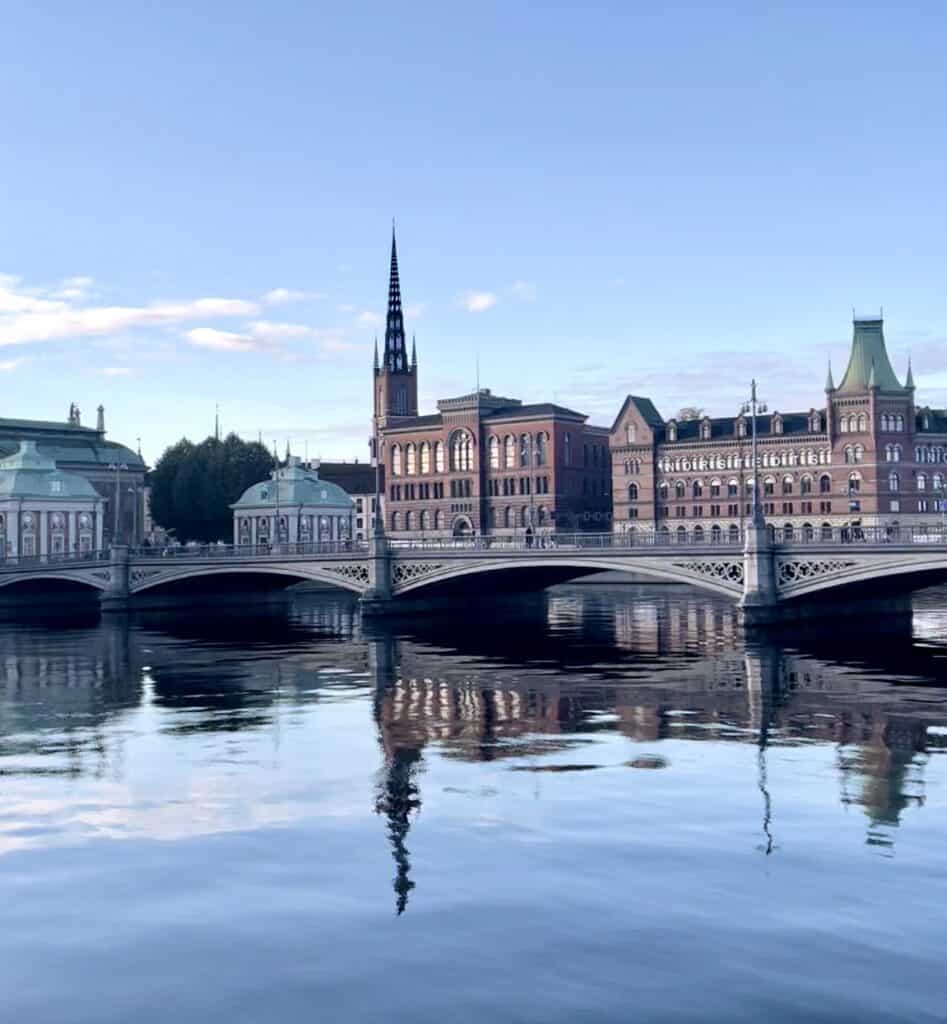 walking over the bridge to riddarholmen church in stockholm