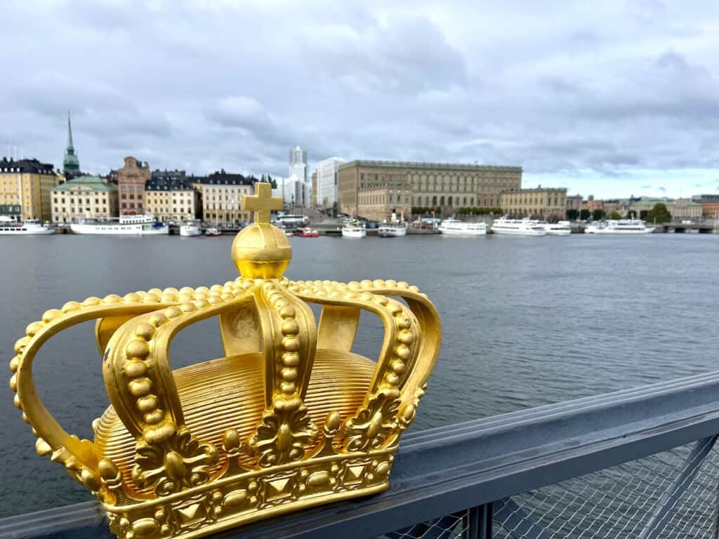 guilded crown on a bridge in stockholm