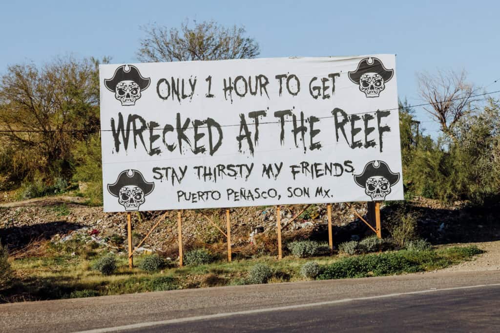wrecked at the reef border sign
