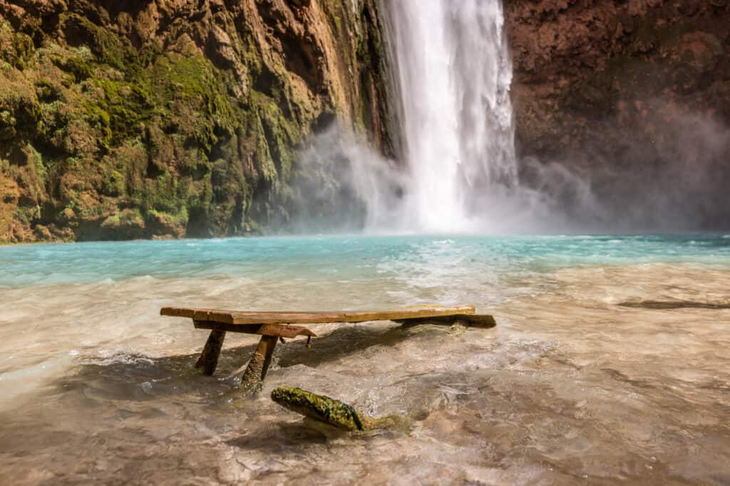 Mooney Falls picnic table in the water