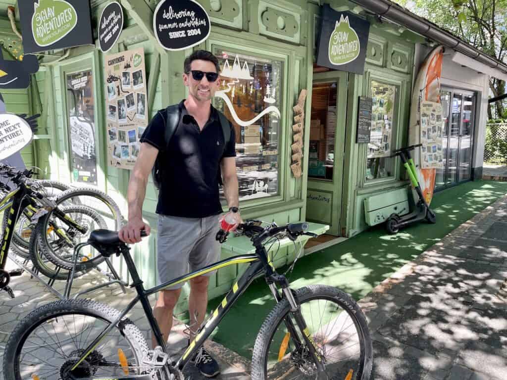 Jared Dillingham renting a bike at Lake Bled