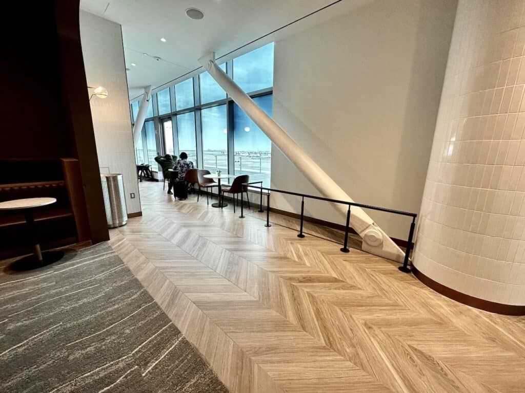 Chevron pattern wood floors in the Delta Sky Club
