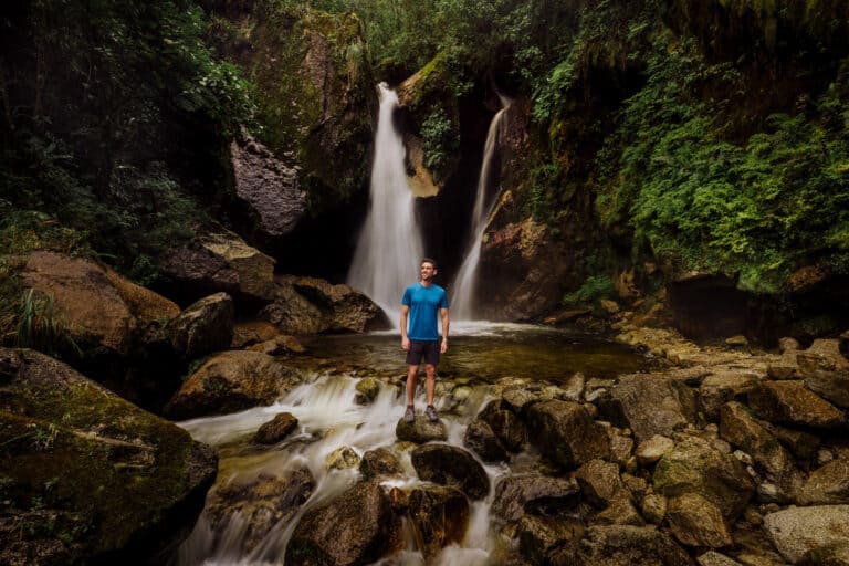 Jared Dillingham at a waterfall in Aguas Calientes Peru