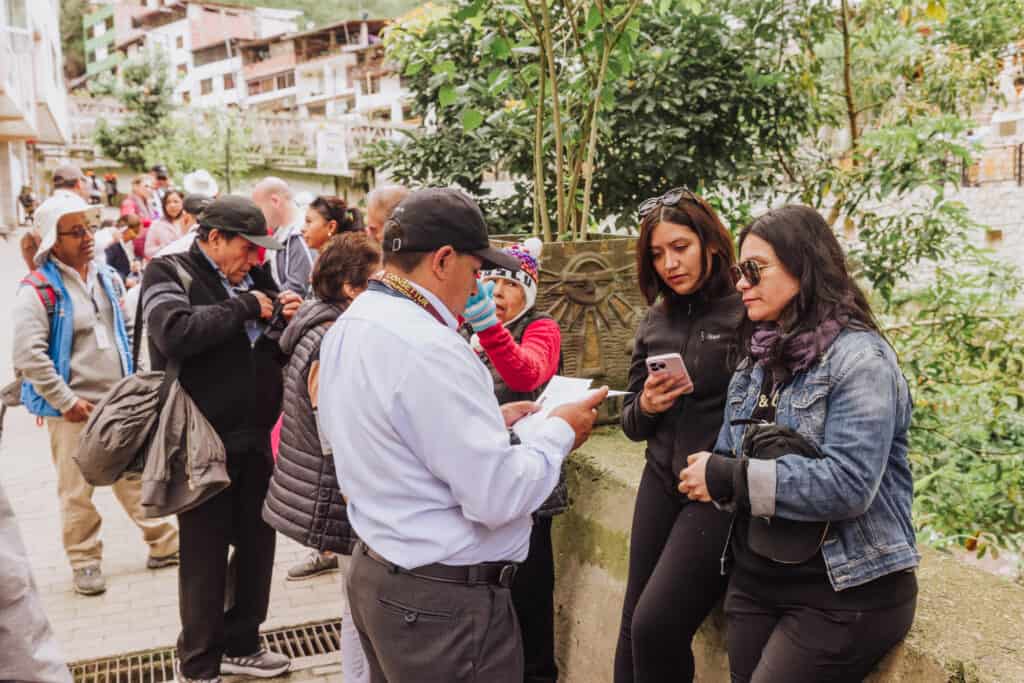 Tour guides near the bus to Machu Picchu