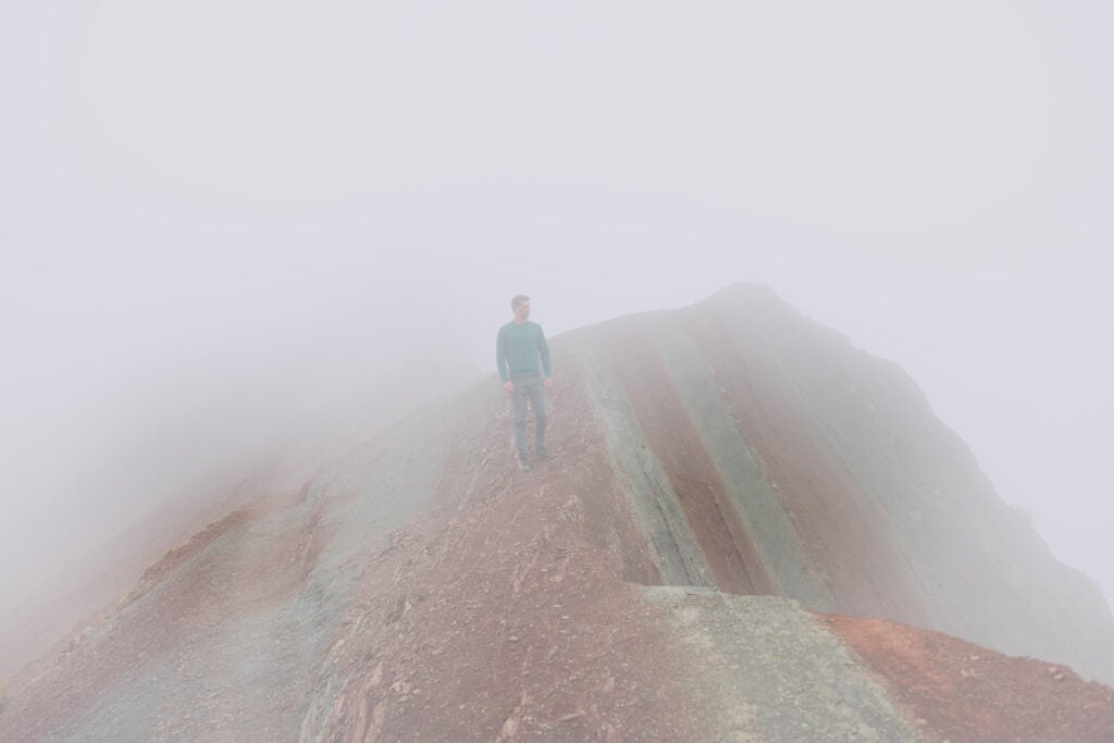 Jared Dillingham hiking in the fog in Peru