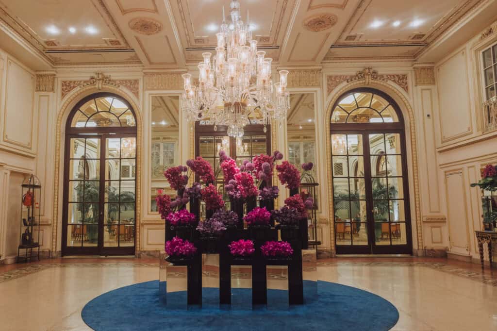 The grand entrance and orchid floral displays at The Plaza Hotel in New Yrok City
