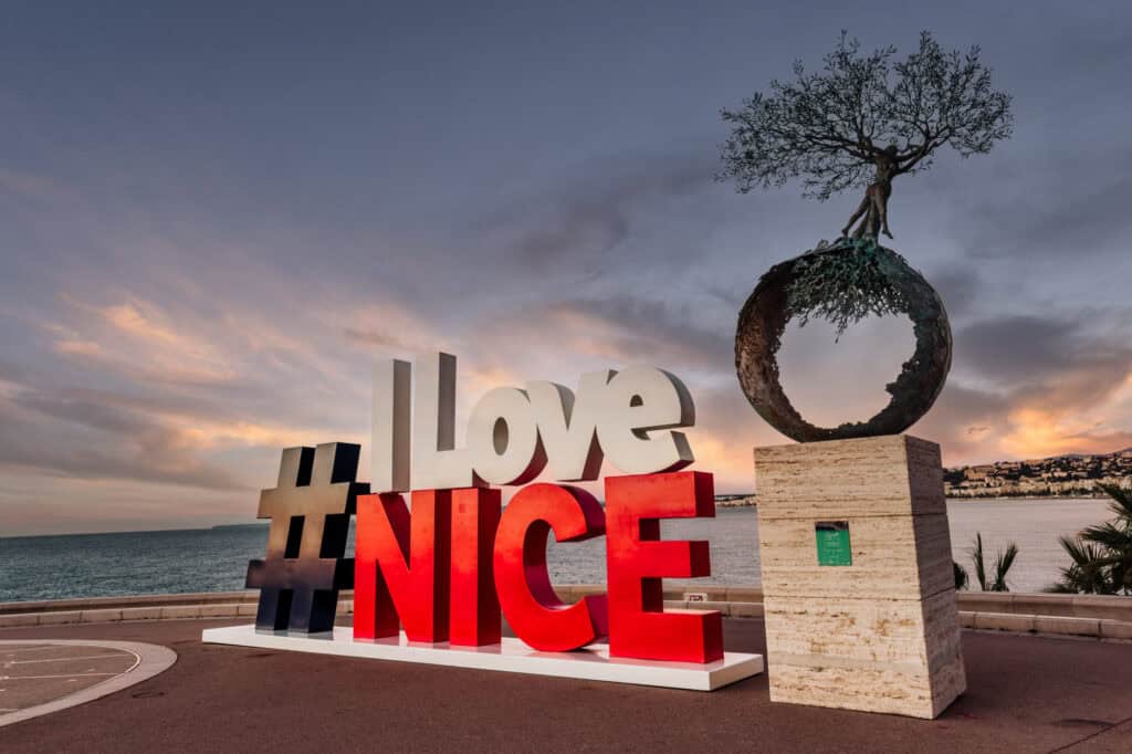 The famous "I love Nice" sign above the city at sunset