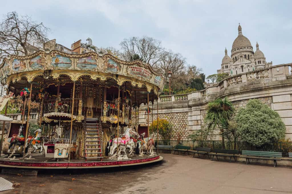 The Sacre Coeur and Montmartre neighborhood at Christmas, with a carousel.
