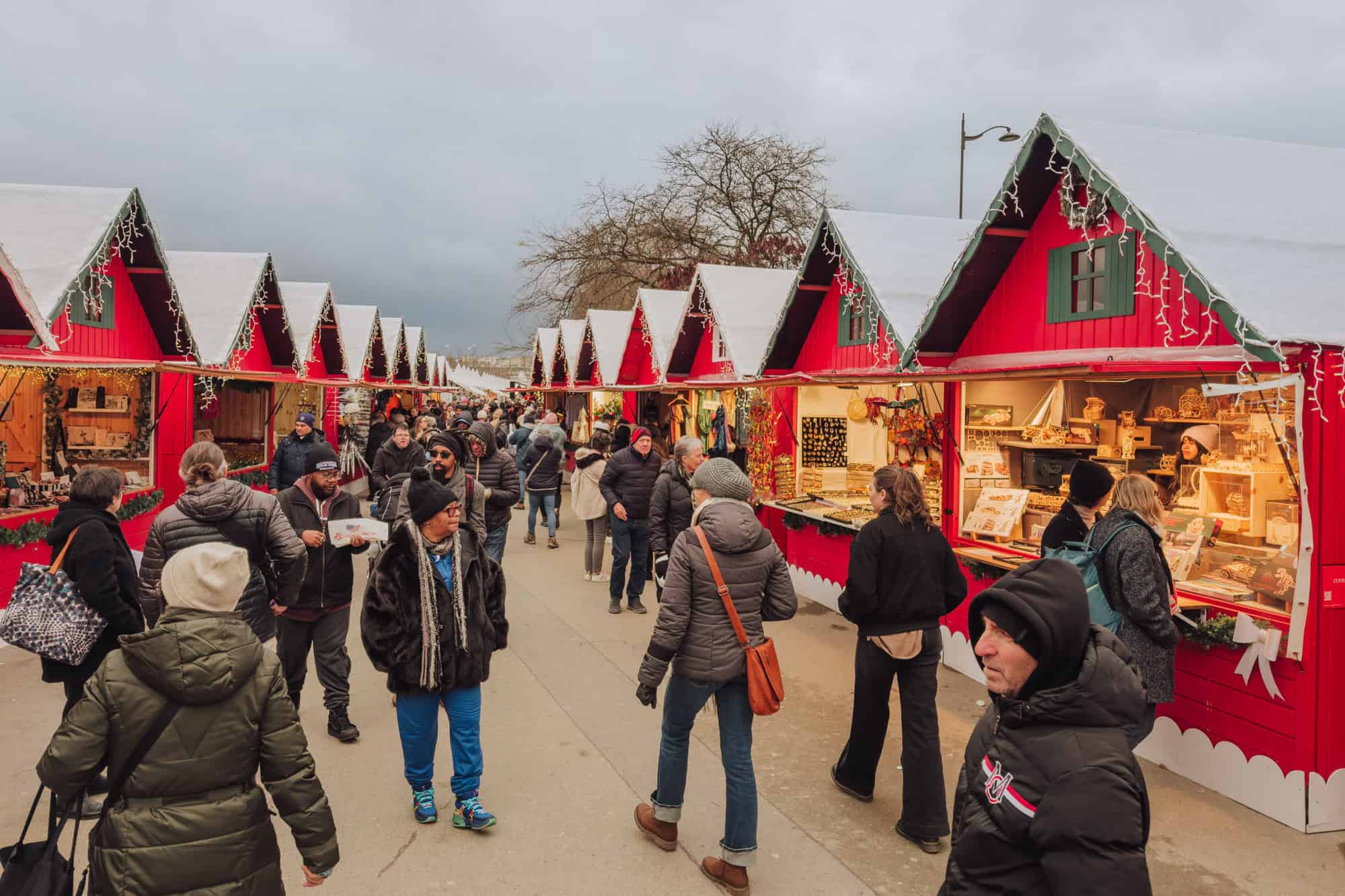 People shopping at the Christmas Market in Paris, near the Eiffel Tower