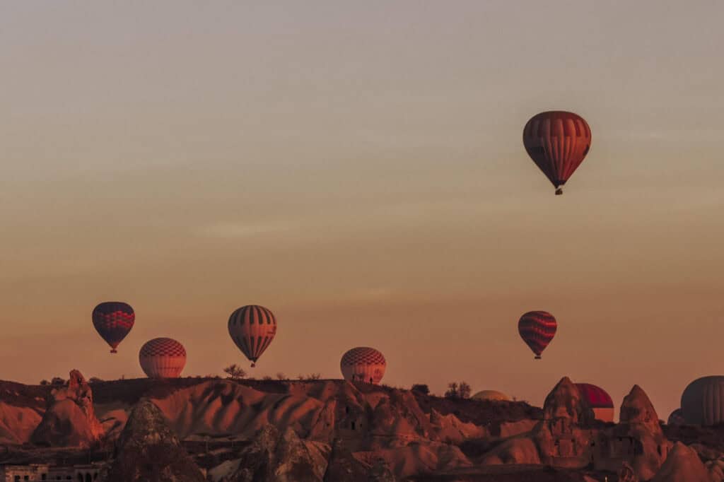 Hot air balloons rising above Cappadocia