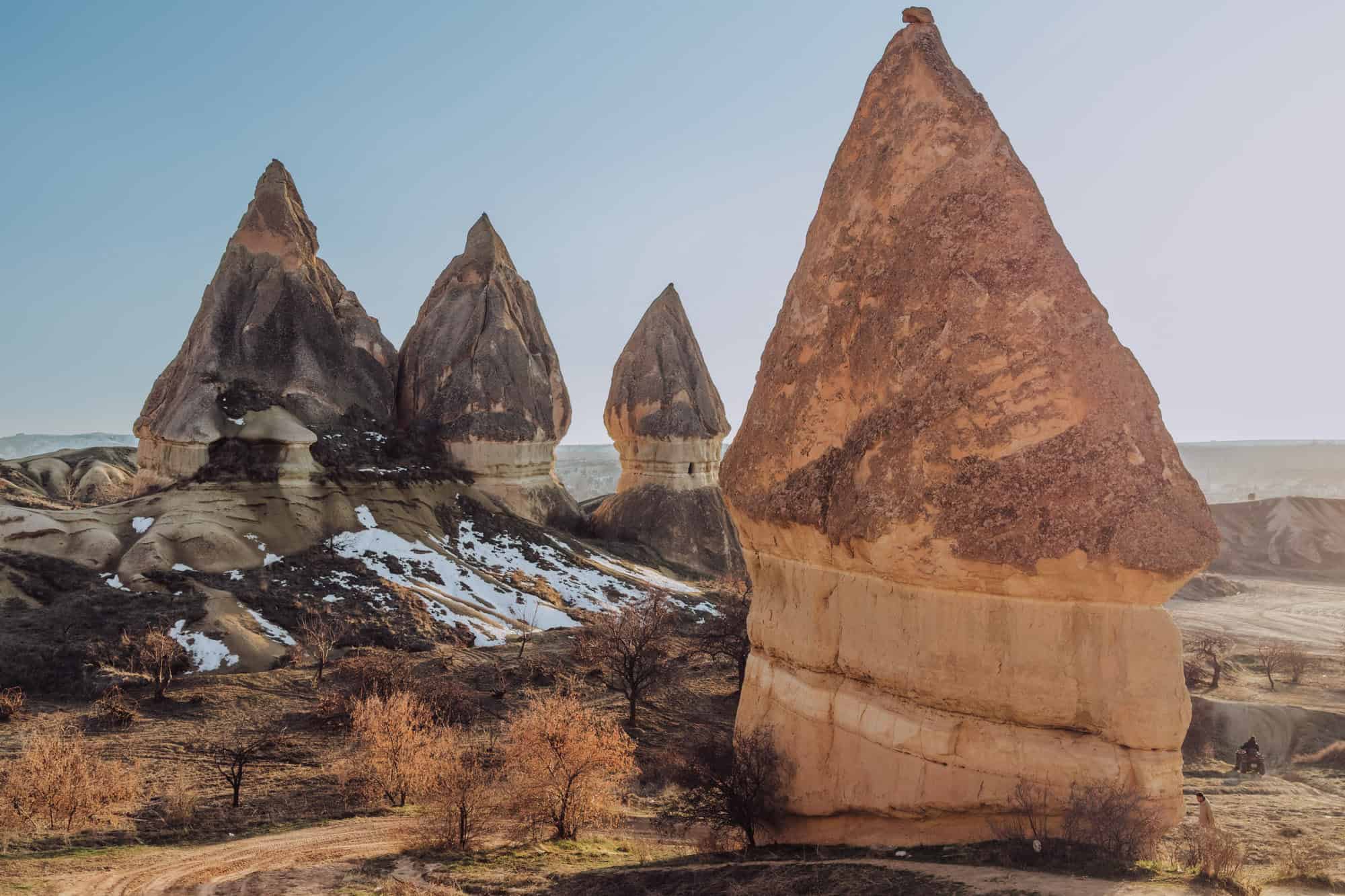 Fairy chimneys with snow in Cappadocia Turkiye