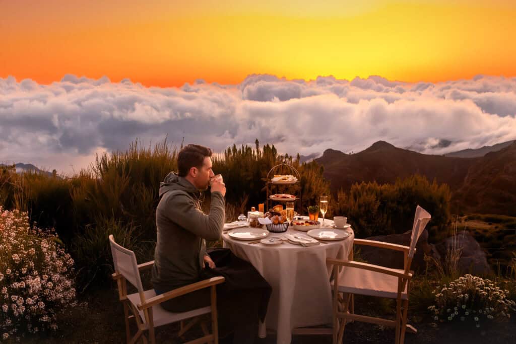 Having breakfast above the clouds at sunrise