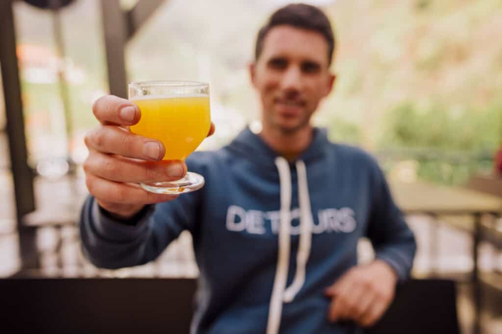 Jared Dillingham drinking ponchas on Madeira, the island's famous rum beverage