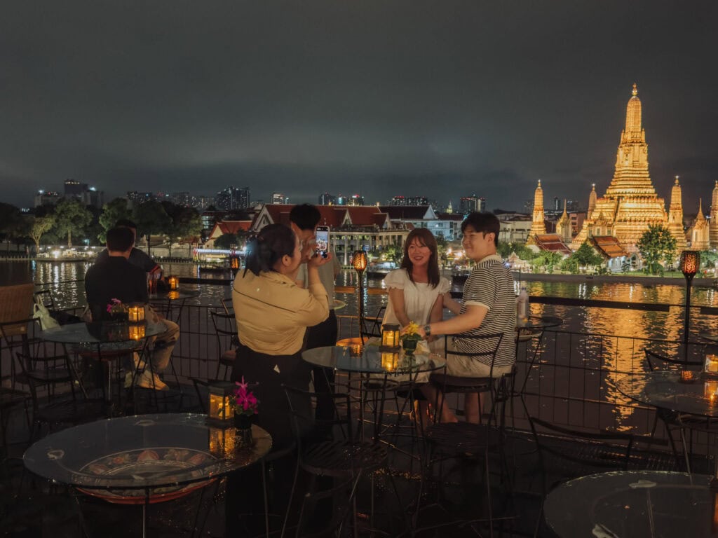 People taking photos from the rooftop bar Eagle's Nest in Bangkok