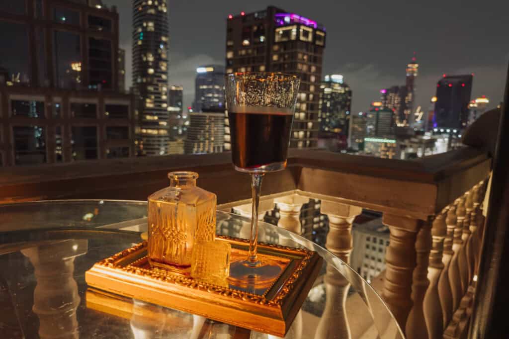 A glass of wine at the rooftop bar at the Hotel Muse in Bangkok