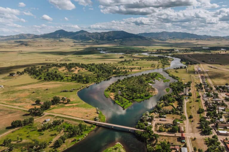 An aerial drone photo of Cascade, Montana, with the Missouri River flowing through