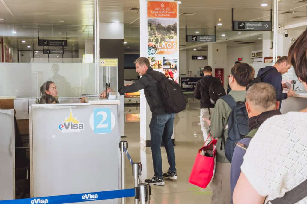 Passport congrol at LPQ, where you'll need a visa to enter Laos