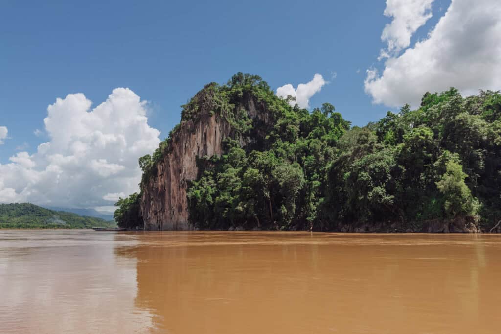 A view of the Pakou Cave from the Mekong River on a tour from Luang Prabang