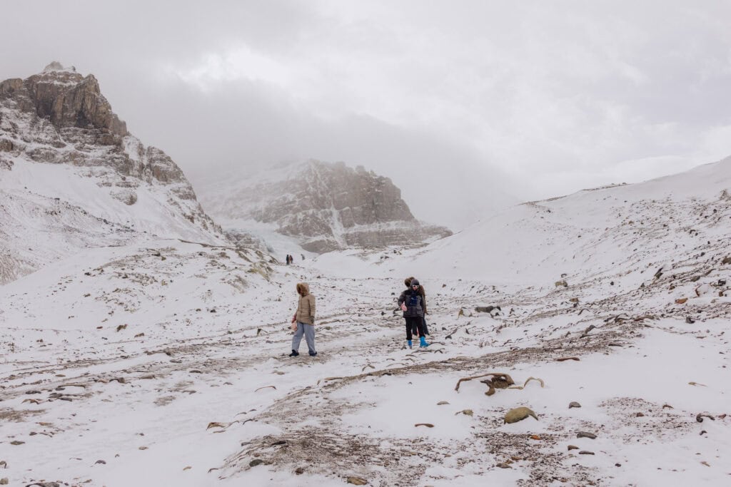 People hiking the Toe of the Athabasca Glacier