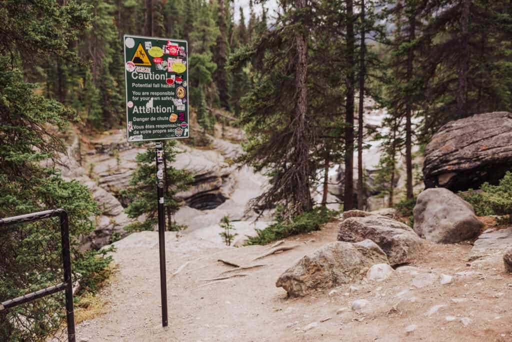Warning signs on a hiking trail in Jasper National Park