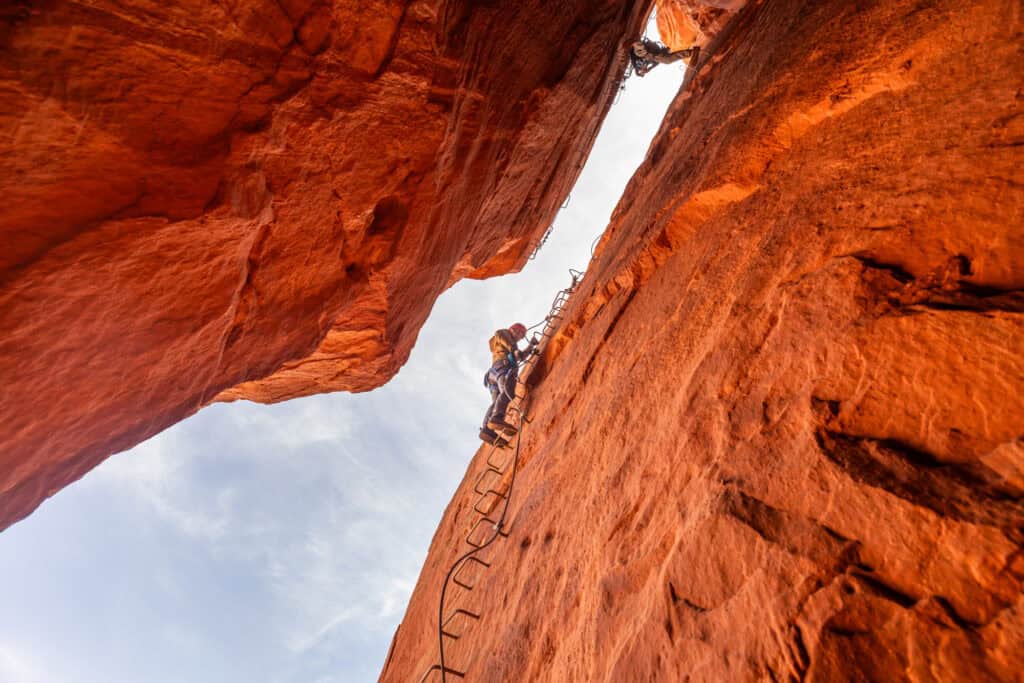 Jared Dillingham climbing down into Antelope Canyon at the Antelope Ridge Adventure Park in Arizona