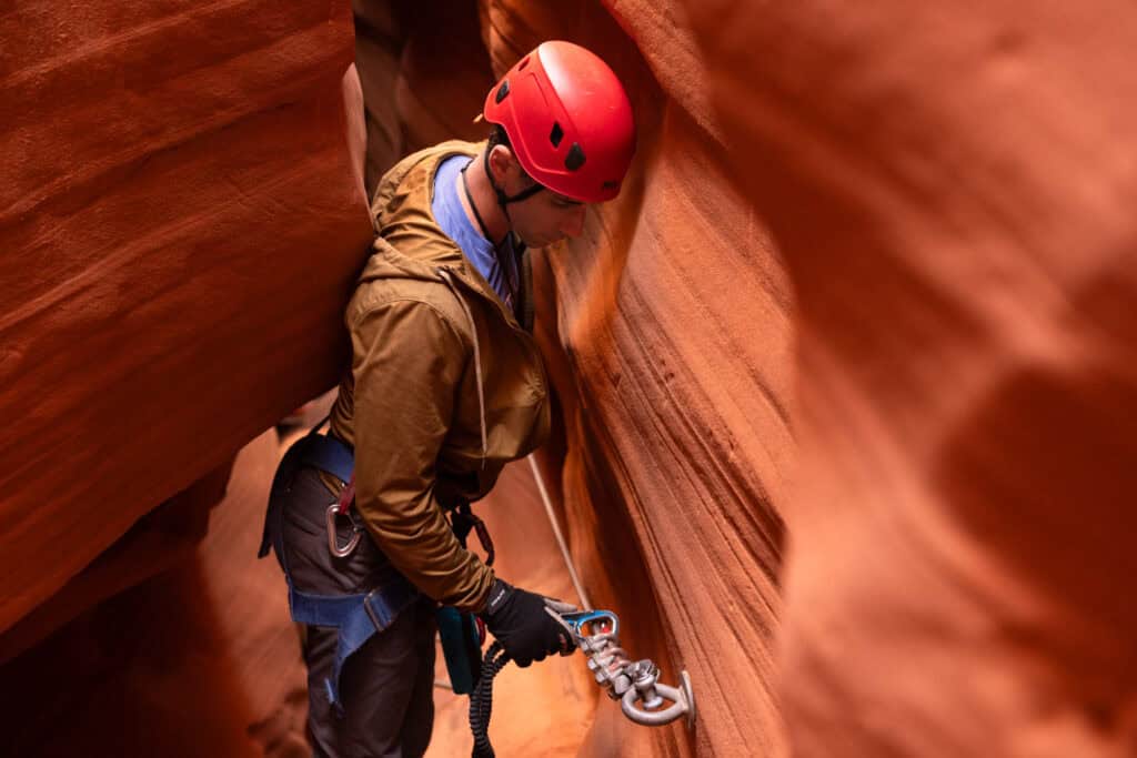 Jared Dillingham clipping into the via ferrata at Antelope Canyon