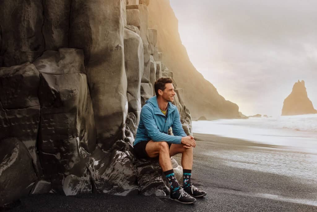Jared Dillingham at Reynisfjara, the black sand beach in Iceland that eroded