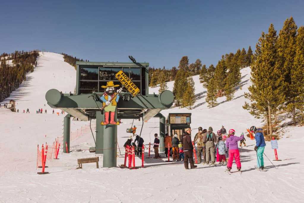 Skiers and snowboarders lining up for the lift at Showdown Montana