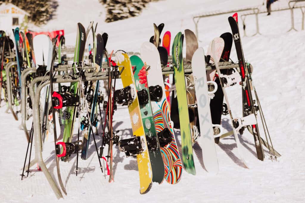 Skis and snowboards lined up on one of the racks at the Montana ski resort
