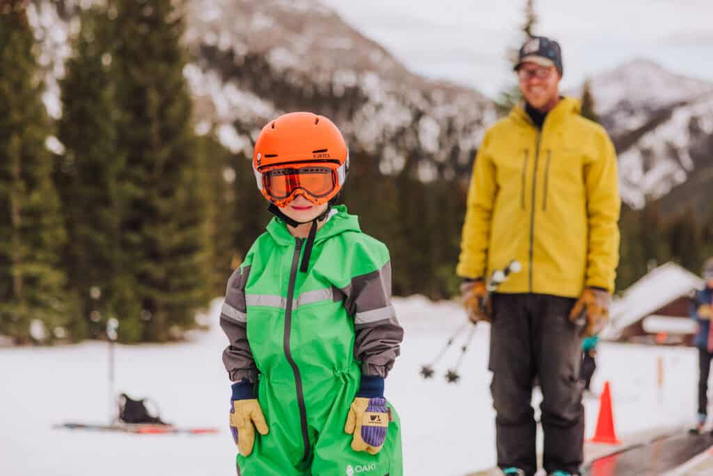 Chuck Hlavac taking his son up the magic carpet to ski
