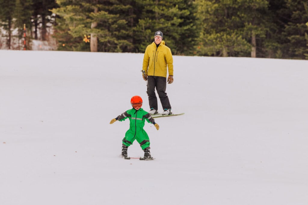 A father and son going down the bunny slope at Teton Pass