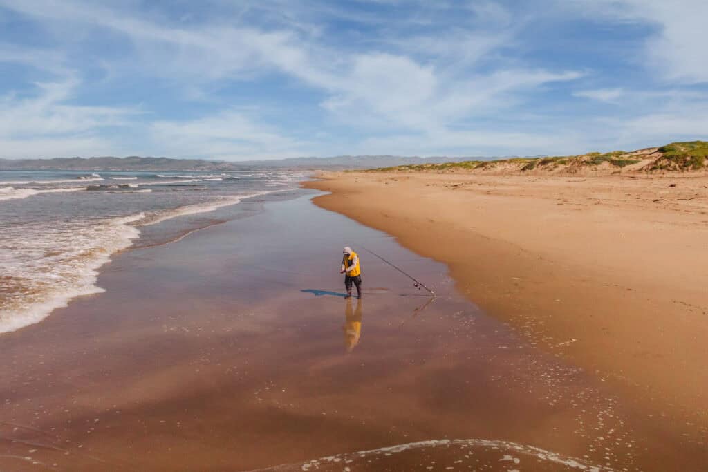 A surf caster fisherman on the central coast of California