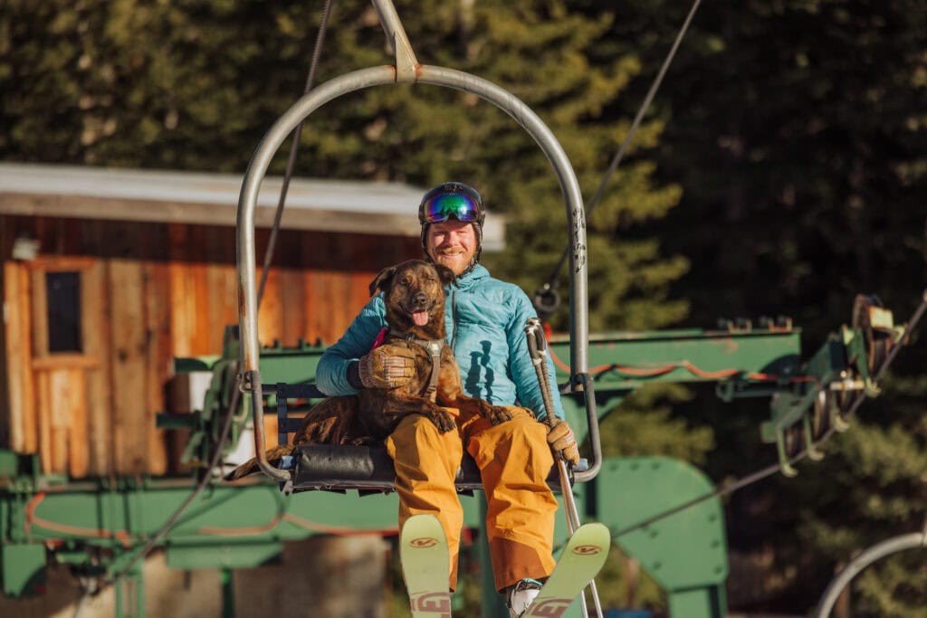 Chuck and his dog, Monster, riding the lift at Teton Pass