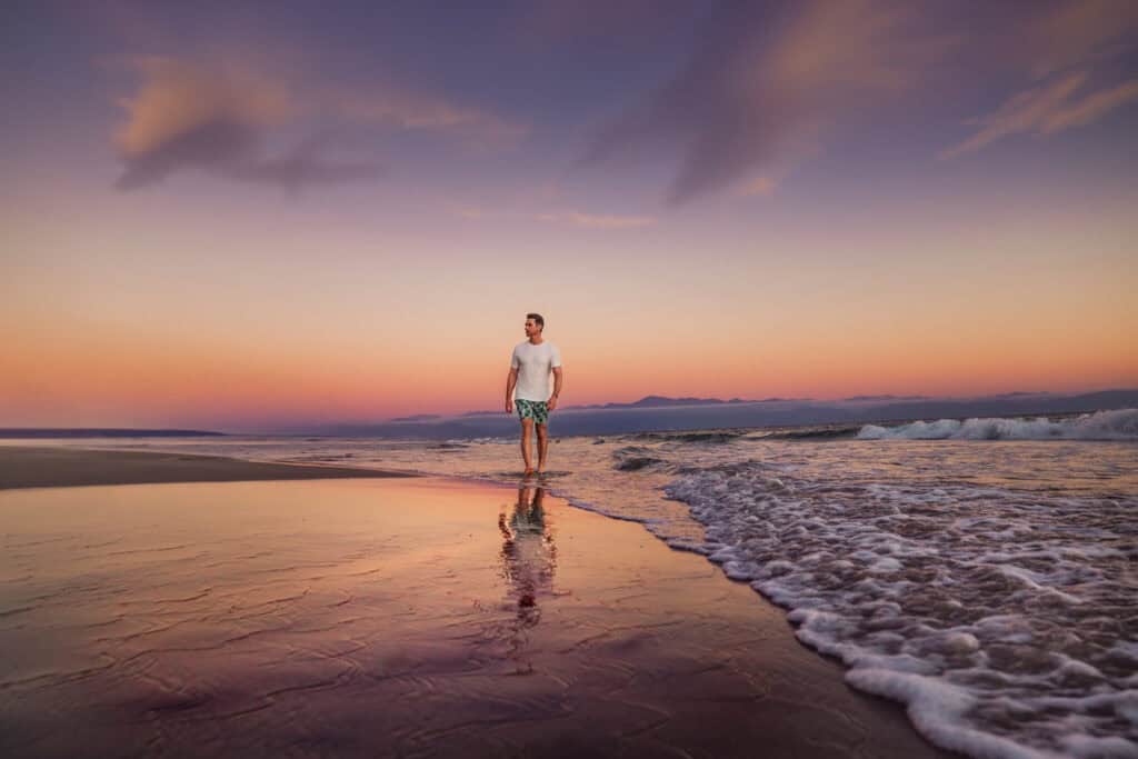 Jared Dillingham walking on the beach at sunset in Nuevo Nayarit Mexico