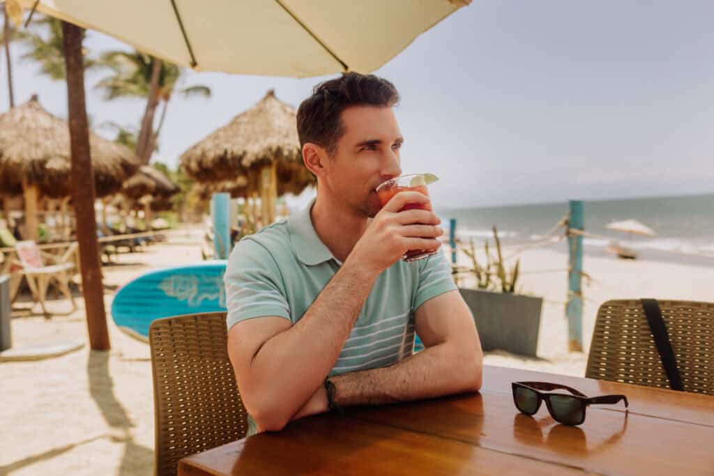 Jared Dillingham having a bloody Mary on the beach at Karen's in Bucerias, Mexico