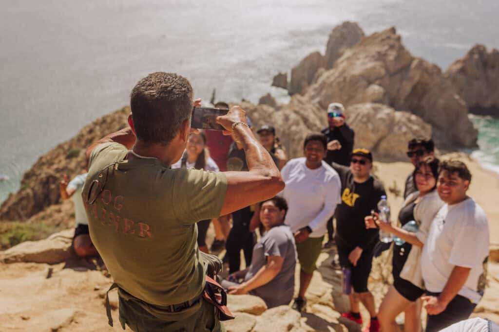 Enrique Morales taking photos of hikers