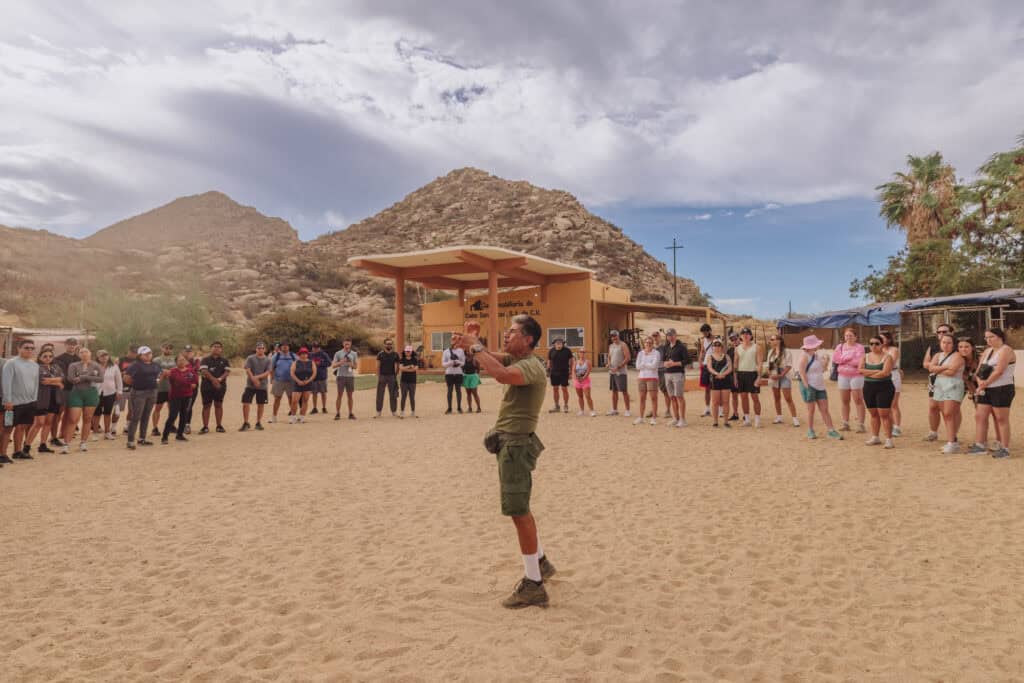 Enrique Morales speaking to hikers
