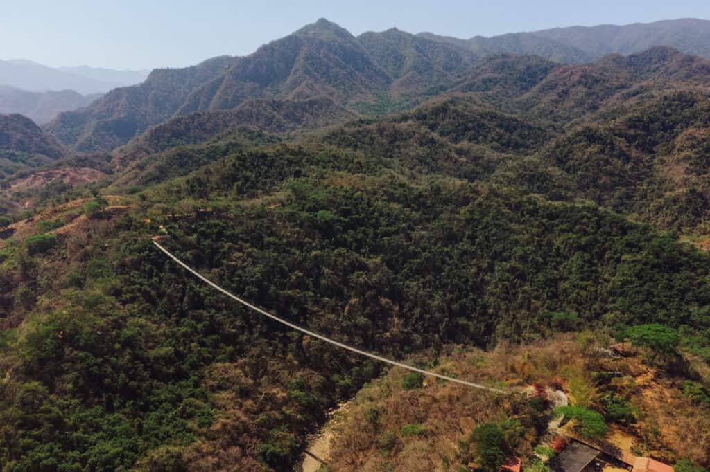 An aerial drone view of the longest suspension bridge in the world at Canopy River Park
