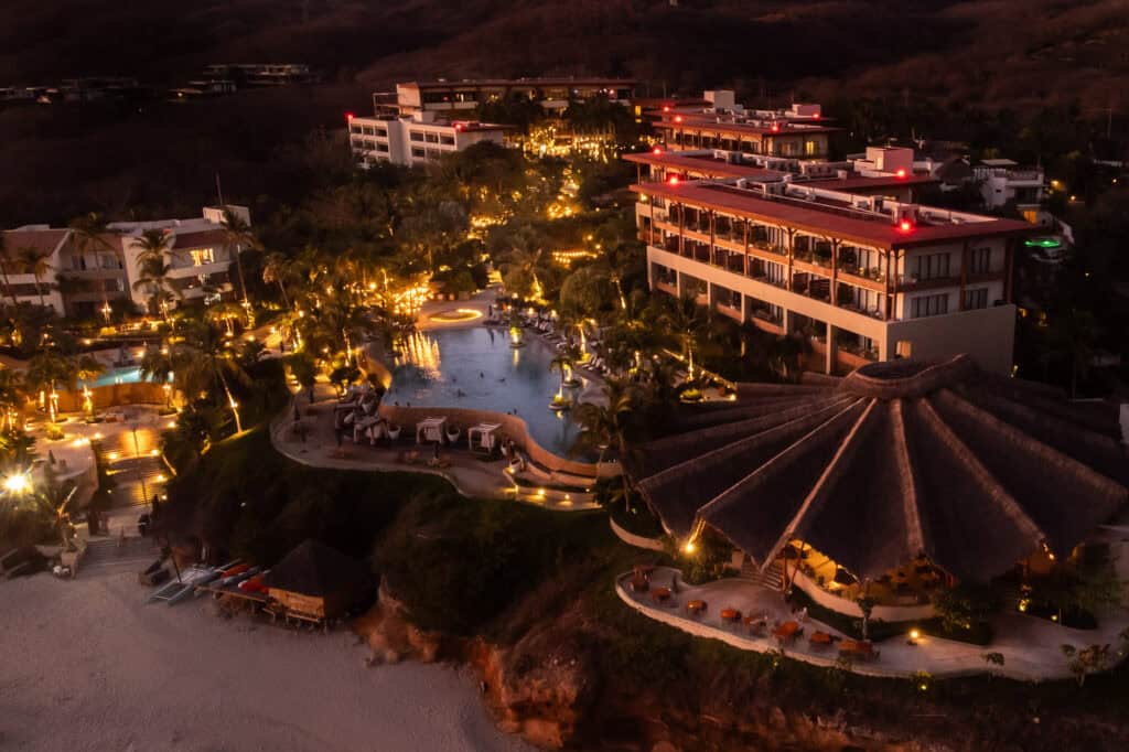 An aerial drone view of Marival Armony at night