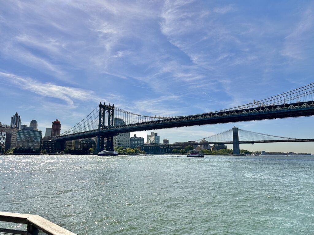 The Manhattan Bridge in the foreground and Brooklyn Bridge