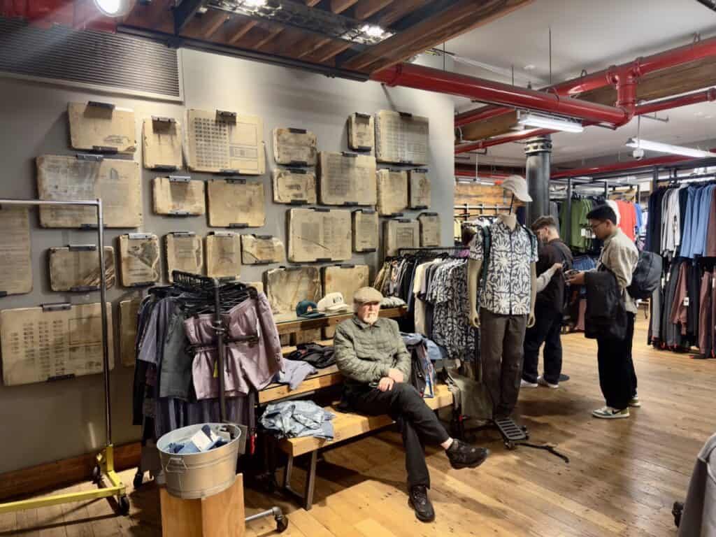 Inside the Puck Building in NYC, where the REI store has historic printing equipment on display