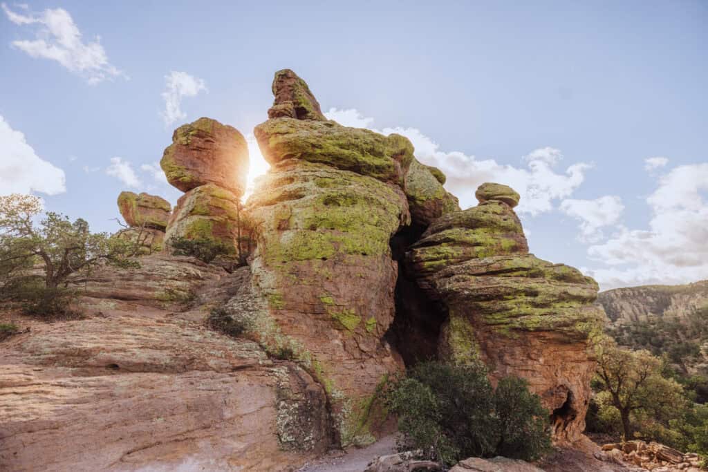 the sun peaking around the rocks at chiricahua national park